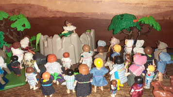 A Bible scene showing Jesus on a mount preaching to the multitudes, who, in this case, are made of Lego characters.